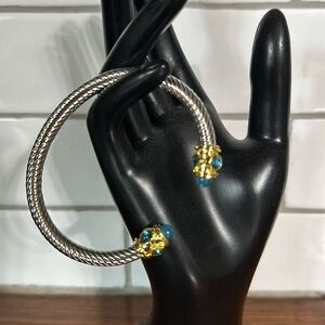 - Sophisticated Silver and Gold Bracelet with Blue Gemstones